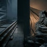 A dark, minimalist scene showing a glowing, arched doorway with a shadowy figure standing inside, partially reflected on a glossy floor, creating a mysterious and atmospheric mood.