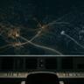 A wide, minimalist, and moody 16:9 fine-art photograph of an empty air traffic control console at night. The scene is cast in deep shadows with a dark palette of charcoal and midnight blue. In the foreground, an empty black office chair sits before a desaturated, dimly lit control desk with retro switches. Through a massive curved window in the background, a complex, sprawling network of glowing, golden particle trails and faint data points stretches across the dark sky like a map, with subtle, warm ochre highlights and two soft, blurred silhouettes of airplanes on a distant, rainy tarmac.