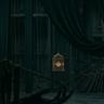 A dimly lit theater stage draped in dark curtains, with rigging ropes and a single illuminated birdcage hanging at the center, creating a dramatic and mysterious atmosphere.
