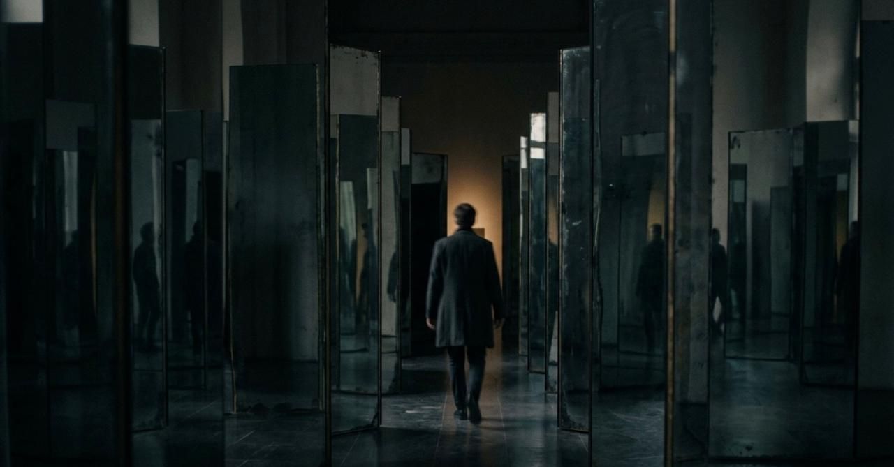 Dark hallway with mirrors representing the complexity and uncertainty of debugging mobile app issues across fragmented environments.